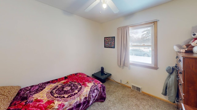 bedroom with visible vents, carpet floors, and a ceiling fan