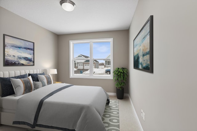 bedroom featuring carpet and baseboards