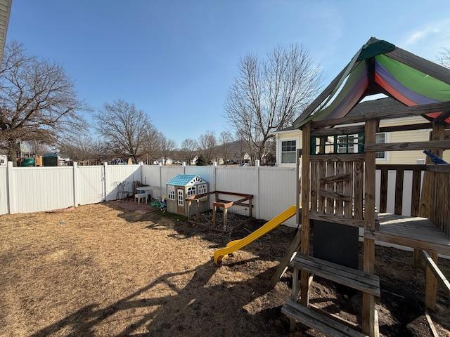 view of jungle gym featuring a fenced backyard