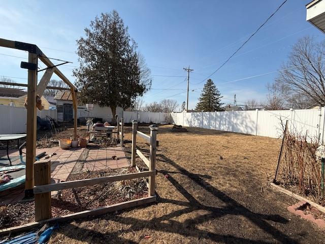 view of yard with a patio and a fenced backyard