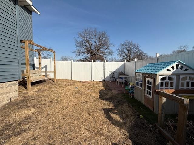 view of yard with a fenced backyard