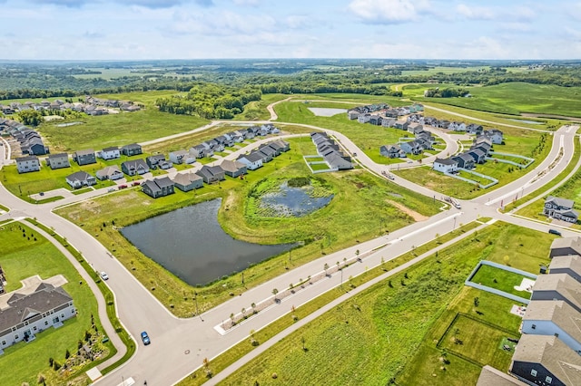 drone / aerial view with a water view and a residential view