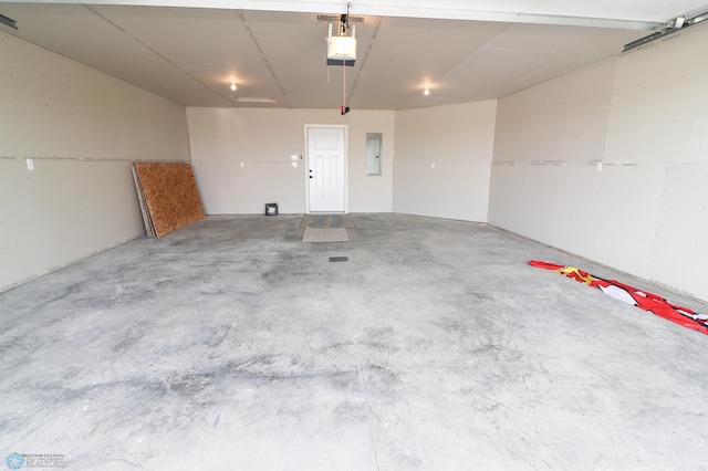 garage featuring a garage door opener and electric panel