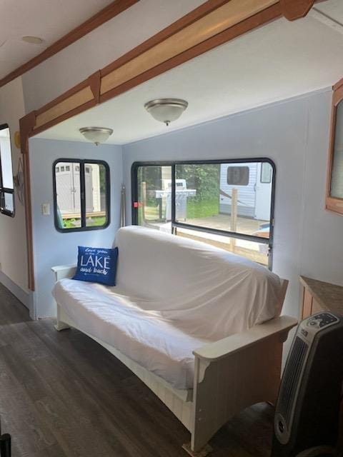 bedroom featuring lofted ceiling and wood finished floors