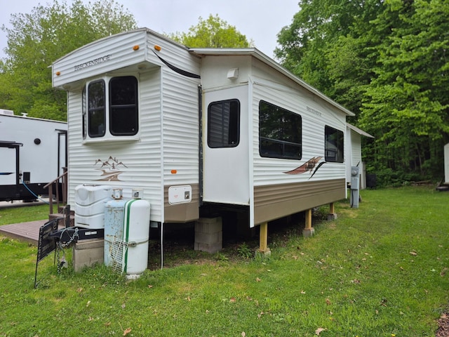 13087 Twilight Rd # 15, Onamia, MN 56359 - view of home's exterior with a yard