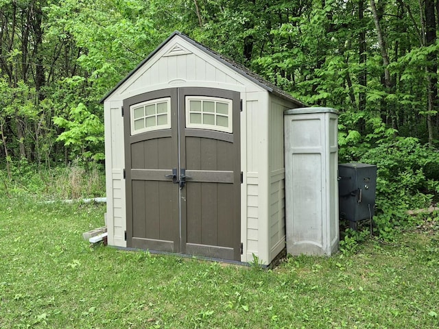 13087 Twilight Rd # 15, Onamia, MN 56359 - view of shed featuring a view of trees