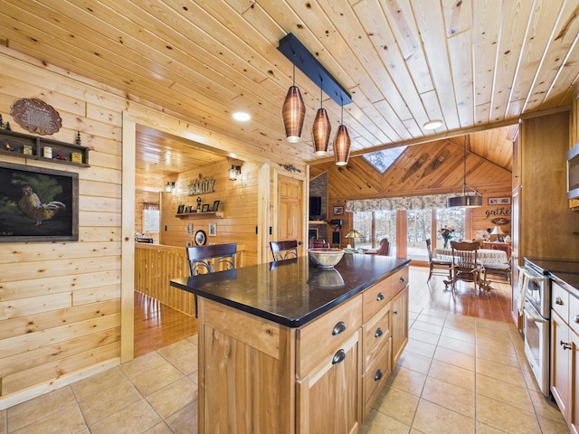 kitchen featuring light tile patterned floors, wooden ceiling, wooden walls, vaulted ceiling, and double oven range