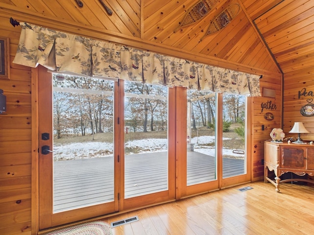 entryway featuring lofted ceiling, wooden ceiling, and visible vents