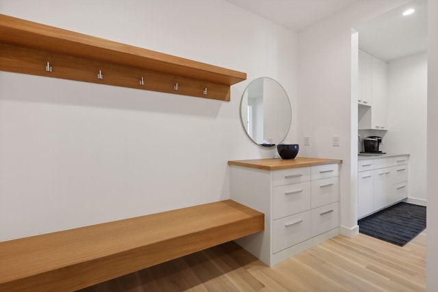 bathroom featuring wood finished floors and vanity