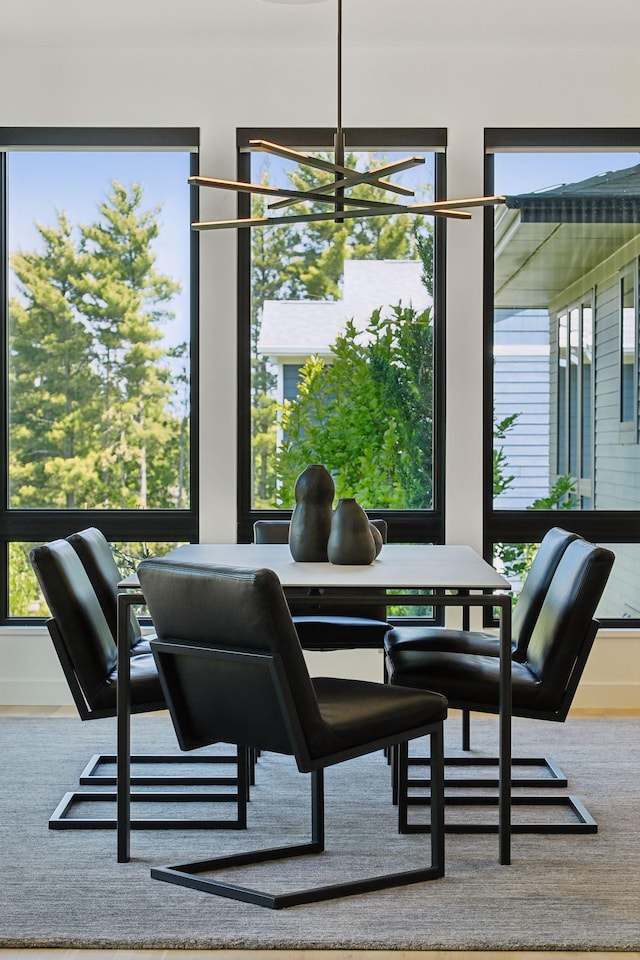 dining space with an inviting chandelier