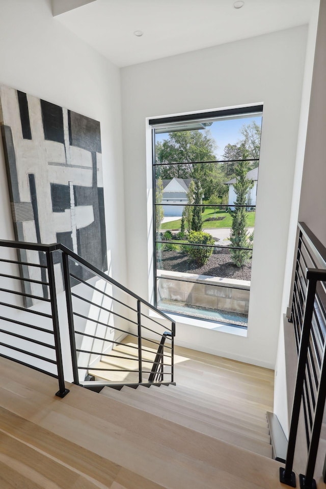 staircase with wood finished floors