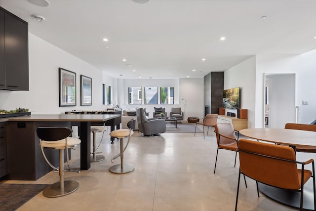 kitchen featuring concrete flooring and recessed lighting