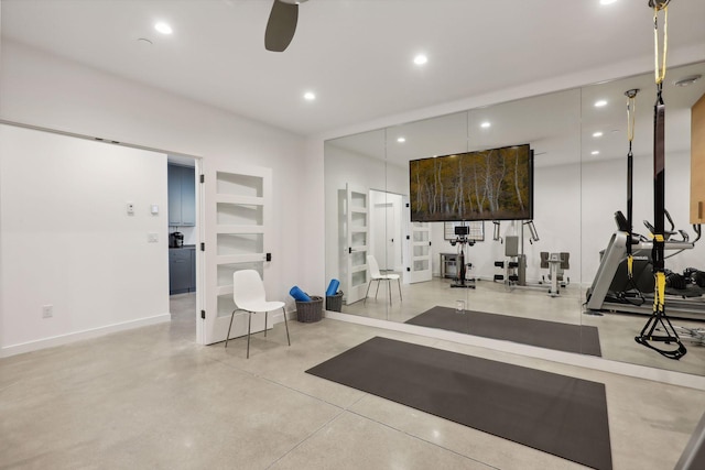 workout room with built in shelves, recessed lighting, ceiling fan, and baseboards