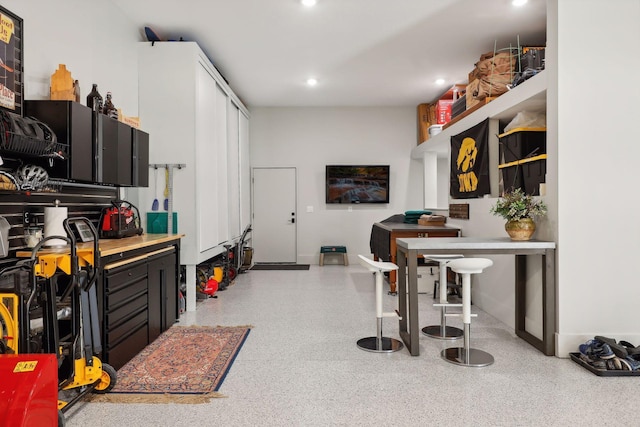 interior space with recessed lighting and baseboards