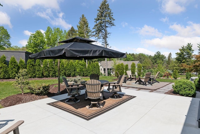 view of patio / terrace featuring an outdoor fire pit