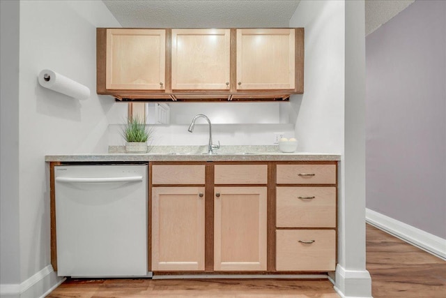 79 Western Ave N Unit 305, Saint Paul, MN 55102 - kitchen featuring dishwasher, light brown cabinets, a sink, and light countertops