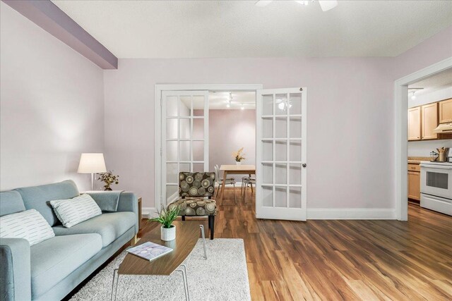 79 Western Ave N Unit 305, Saint Paul, MN 55102 - living room featuring wood finished floors, baseboards, french doors, and ceiling fan