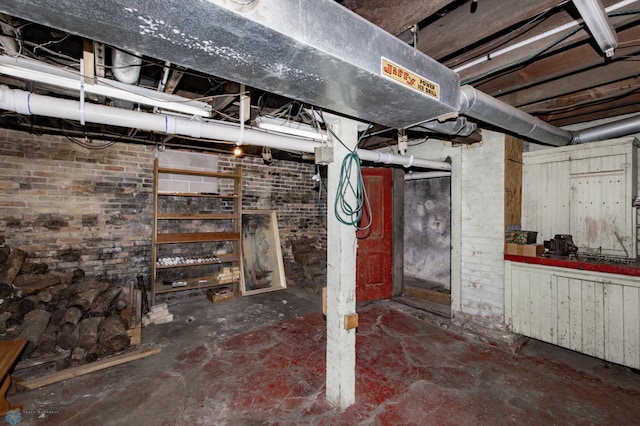 unfinished basement with brick wall