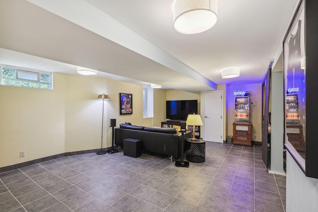 tiled living room featuring baseboards