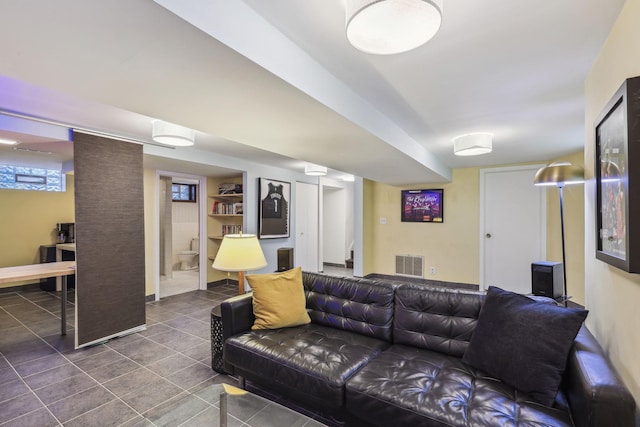 tiled living room featuring visible vents