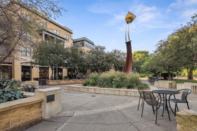 view of property's community featuring a patio area