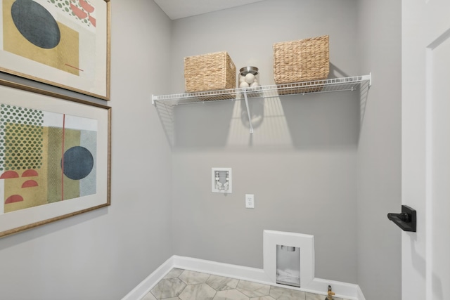 laundry room with laundry area, hookup for a washing machine, and baseboards