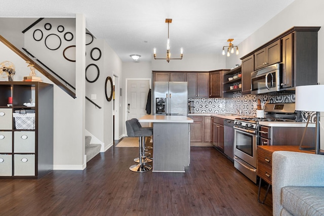 kitchen featuring open shelves, stainless steel appliances, dark brown cabinetry, light countertops, and decorative backsplash