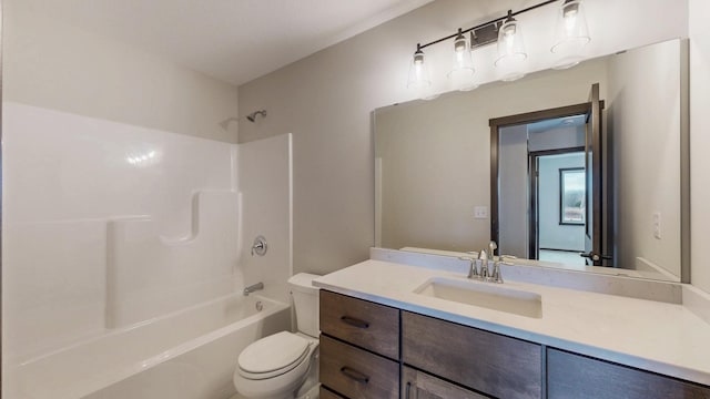 bathroom with bathtub / shower combination, vanity, and toilet