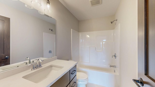 full bath with toilet, visible vents, shower / washtub combination, and vanity