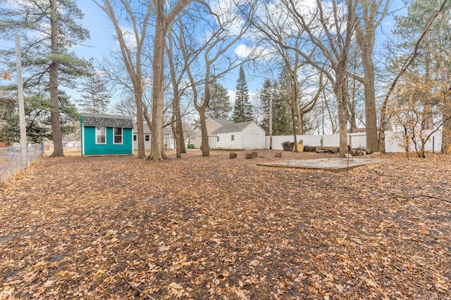 view of yard with an outbuilding and a fenced backyard