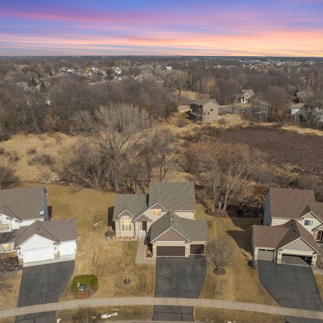 aerial view at dusk with a residential view