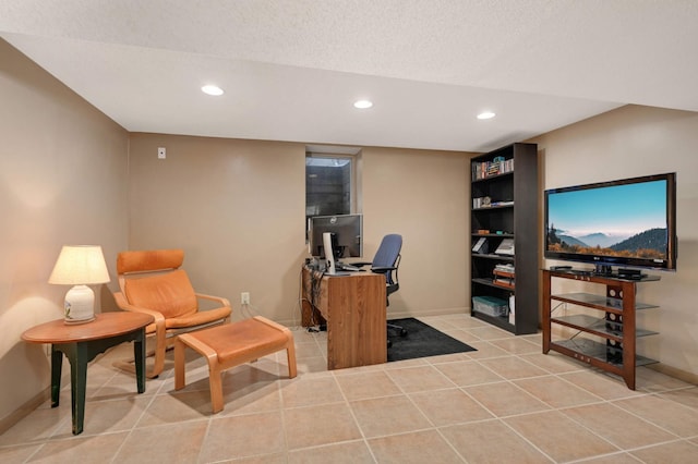 office area featuring recessed lighting, a textured ceiling, baseboards, and tile patterned floors