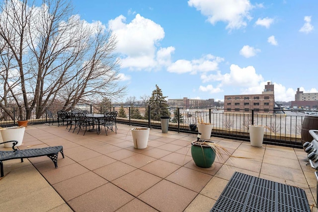 view of patio / terrace with a city view and outdoor dining area