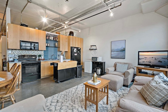 living room featuring finished concrete floors