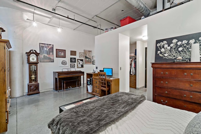 bedroom featuring a walk in closet