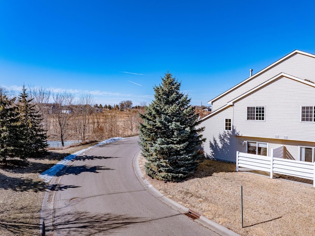 view of side of home with fence