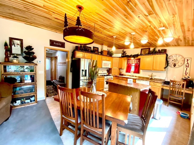 dining area featuring wooden ceiling and concrete floors