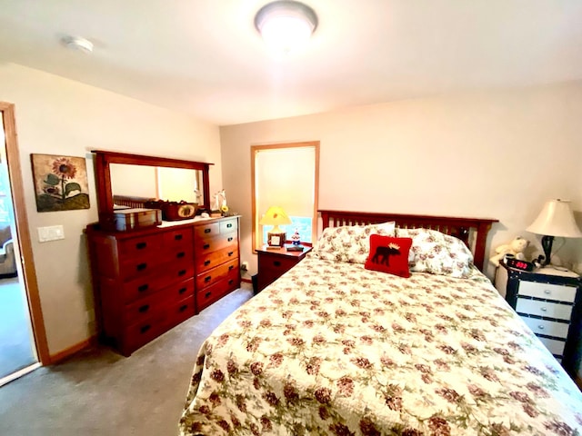 bedroom featuring carpet floors and baseboards