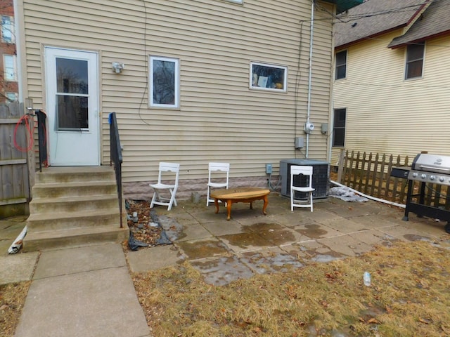 exterior space with entry steps, central AC, and area for grilling