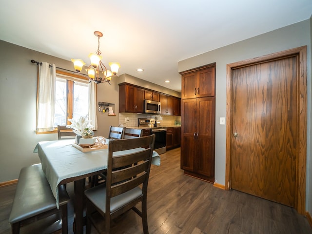 dining room featuring recessed lighting, baseboards, an inviting chandelier, and dark wood-style flooring