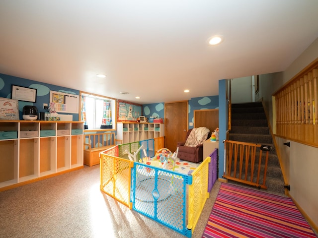 interior space featuring recessed lighting and stairway