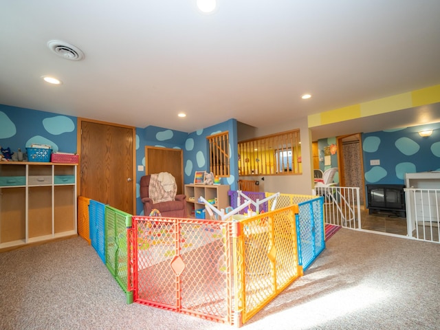 carpeted living area featuring recessed lighting and visible vents