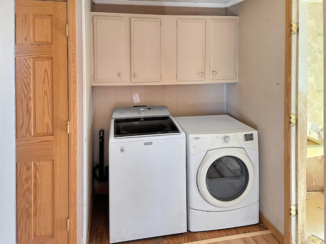 laundry room featuring cabinet space and washing machine and clothes dryer