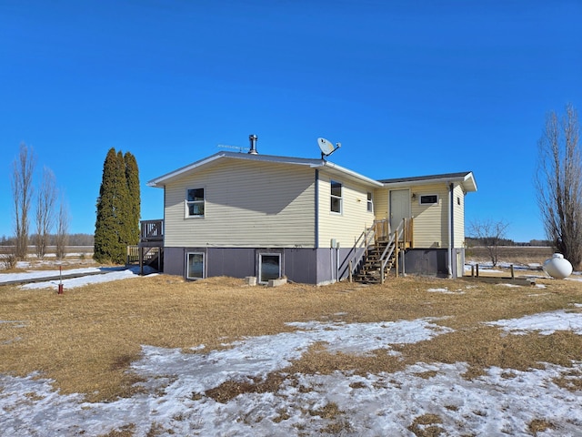 view of snow covered house