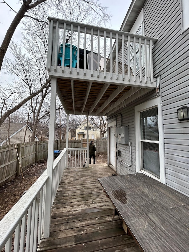 deck with a fenced backyard