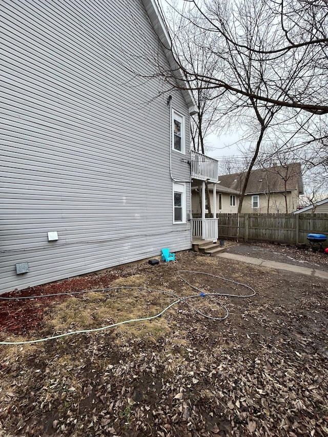 view of property exterior with fence