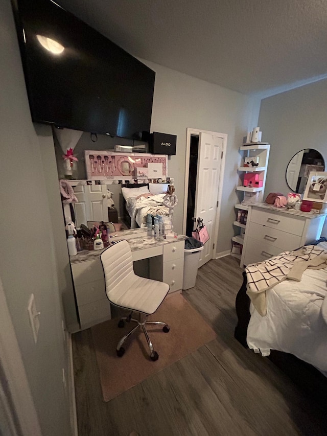 bedroom with wood finished floors