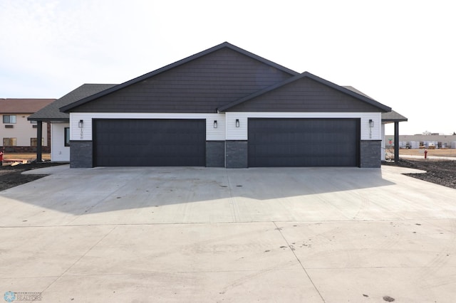 garage with concrete driveway