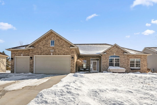 view of front of property with brick siding and an attached garage