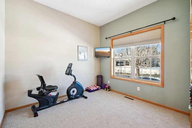 workout area featuring visible vents, baseboards, and carpet flooring